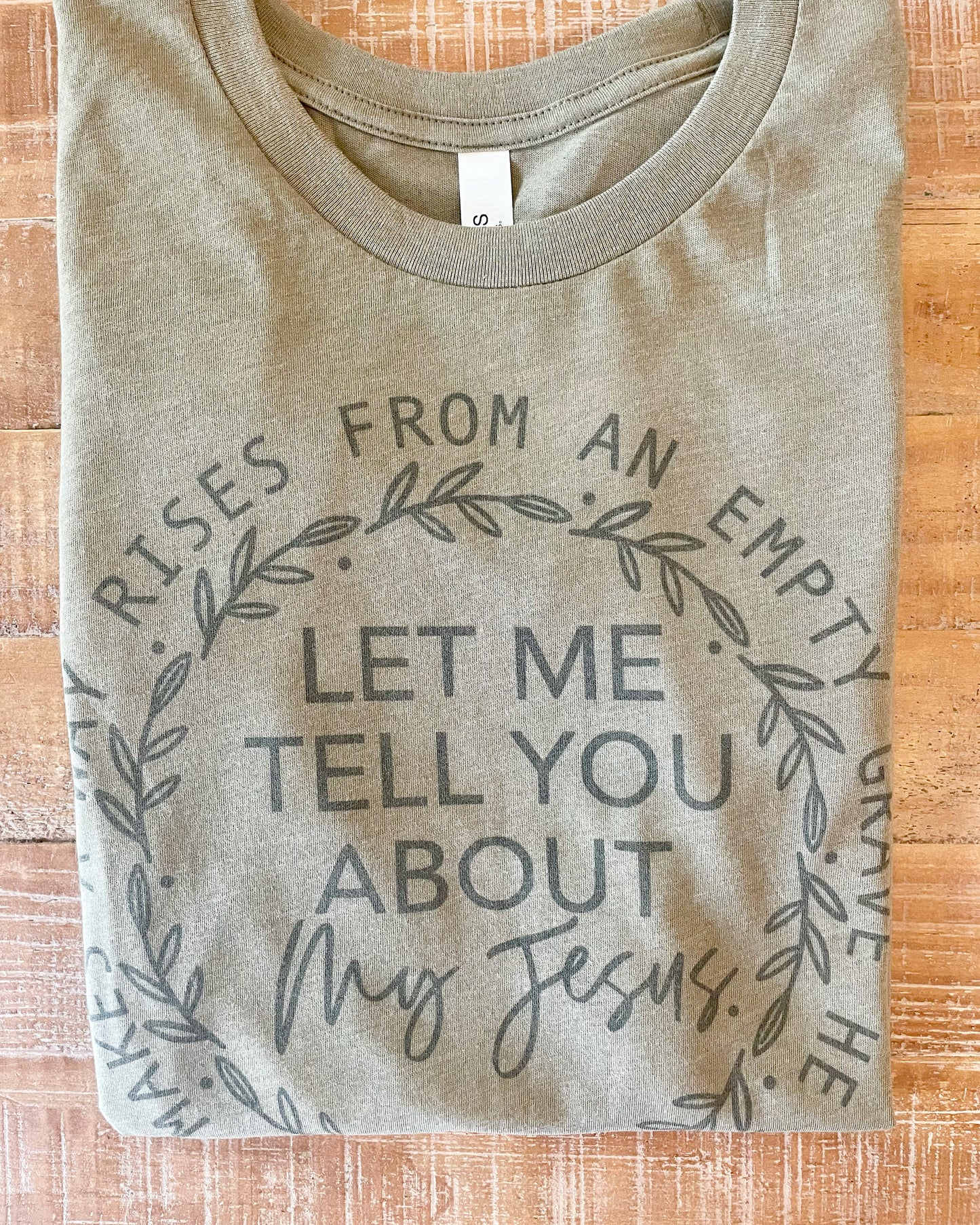 Let Me Tell You About My Jesus Heather Olive Graphic Tee